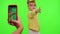 Happy funky blogger child kid girl, recording funny dancing video on smartphone for social network