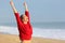 Happy funny excited woman on the beach