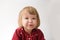 Happy funny little girl emotional playing. cute caucasian blond baby