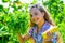 Happy gardener girl growing fresh food just from farm