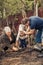 Happy gardener grandparents grandchild together planting tree grandparenting save trees environmental conservation concept