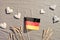 Happy Germany Thanksgiving Day or Erntedankfest in German language. German flag on beige textile. Flat lay, top view