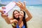 Happy gilrls selfie on beach