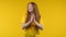 Happy ginger woman applauding on yellow background. Smiling lady emotional claps hands, congratulating. Support