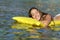 Happy girl bathing on the beach in summer vacation