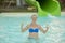 Happy girl in bikini sliding water park. Woman in a blue swimsuit. toned