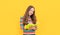 Happy girl child write down in copybook yellow background, writing