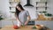 Happy Girl Cutting Vegetables in Kitchen