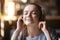 Happy girl enjoy music in modern Bluetooth headphones