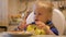 Happy girl enjoying a meal. Young child eating lunch happily. Little girl savouring her food.