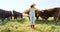 Happy, girl and farm, cow and sustainability in agriculture with a smile for growth, freedom and portrait. Countryside