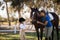 Happy girl and female jockey stroking horse