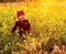 Happy girl with field flowers