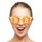 Happy girl in glasses with bitcoin signs