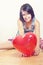 Happy girl with heart balloon