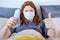 A happy girl holds dollars in her hands for flu treatment. A sick woman in a mask looks at the money and gives an approving thumbs