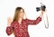 Happy girl make selfie photo with old fashioned camera. modern technology concept. journalist. woman with retro camera