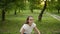 Happy girl making having fun outdoors. Teenage girl dancing outside.