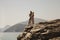 Happy girl and man in beach clothes kiss on coastal cliff