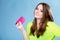 Happy girl with mobile phone in pink cover