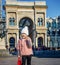 Happy girl at Piazza del Duomo in Milan, Italy handwaving