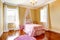 Happy girl room with pink canopy bed