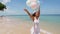 Happy girl running on the beach, holding balloons in hand. slow motion. Concept happiness, freedom, vacation, love