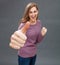 Happy girl showing large thumbs up with willing body language