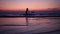 Happy girl silhouette at sunset sea horizon, joyfull children freedom concept