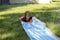 Happy girl slide to cool off on hot day during spring or summer