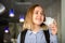 Happy Girl student takes off protective medical mask. Portrait of blonde female student at university in the end of coronavirus