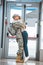 Happy girlfriend hugging cheerful boyfriend in military uniform