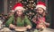 Happy girlfriends preparing gingerbread under christmas tree