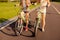 Happy girlfriends together to ride a bicycle