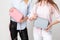Happy girlfriends women in shirts with stylish handbags. Fashion spring image of two sisters. Pastel pink and blue