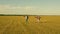 Happy girls run with toy plane at sunset on field. concept of happy childhood. Girls dream of flying and becoming a