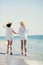 happy girls running on the sea beach