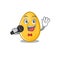 Happy golden egg singing on a microphone