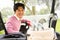 Happy golfer driving his golf buggy smiling at camera