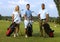 Happy golfers with golfing kit