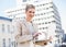 Happy gorgeous businesswoman working on laptop