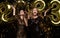 Happy gorgeous girls in stylish sexy party dresses holding gold 2023 balloons, having fun at New Year& x27;s Eve Party.