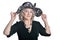 Happy gorgeous mature woman in hat posing against white background