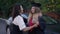 Happy graduate daughter hugging mother giving car key in slow motion. Portrait of thankful Caucasian beautiful young