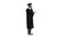 Happy graduated young man in cap and gown talking with parent on mobile phone on white background.