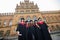 Happy graduates. Five college graduates standing in a row and smiling