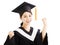 Happy graduating asian student raise hand with success gesture