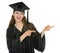 Happy graduation student girl pointing sideways