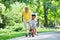 Happy grandfather and child in park