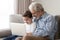 Happy grandfather and cute little grandson using laptop together